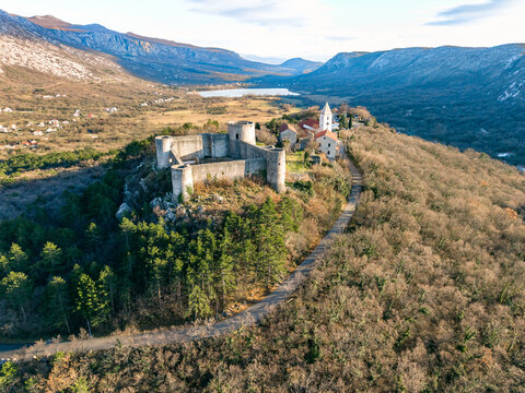 Aerial view of the Drivenik Castle in the northern part of the Adriatic Sea, Croatia and Vinodolska dolina surrounded by high mountains