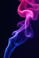Obraz premium Abstract red purple and blue smoke swirling against a dark black background, design, fantasy