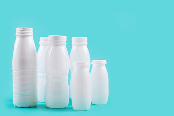 Plastic bottles presented against a blue backdrop, highlighting the significance of eco-friendly...