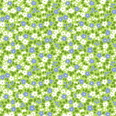 Beautiful floral pattern in small vintage flowers. Small blue and white flowers. Green background. Ditsy print. Floral seamless background. Spring Easter template for fashion prints. Stock pattern. © ann_and_pen