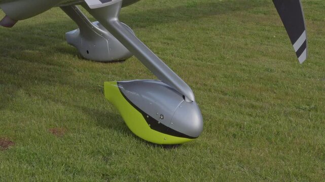 Landing Gear Green JMB VL3 Ultralight Private Aircraft Aviation Parked at Regional Airstrip on Grass Close Up