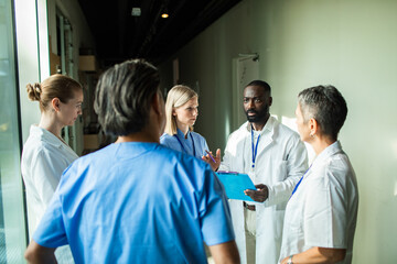 Medical team discussing patient care in hospital lobby