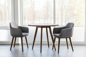 Contemporary dining set in minimalist interior with natural light through large windows