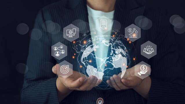 Global business network connection on social networking and customer data analytics concept, Businesswoman holding global icon - Powered by Adobe