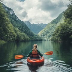 Woman kayaking on a scenic river between green mountains, enjoying adventure and nature in a peaceful setting.