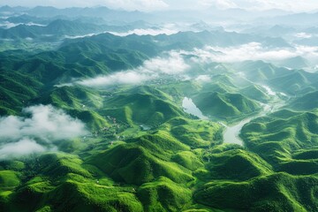 Obraz premium Mist-shrouded rolling green hills and mountains