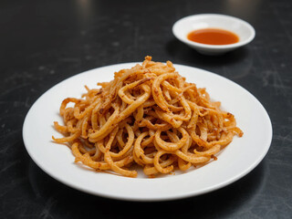 Fried onions served on a white plate, made with AI