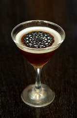 glass of drink on wooden table