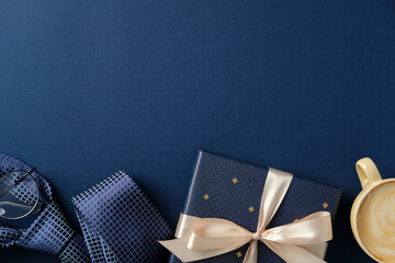 Happy Father's day concept. Elegant composition with a blue gift box, glasses, coffee cup, and tie...
