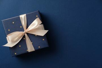 Happy Fathers Day gift box on navy blue background. Flat lay, top view.