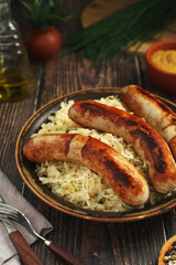 A bowl with Bratwurst and Sauerkraut as side dish - traditional German food	