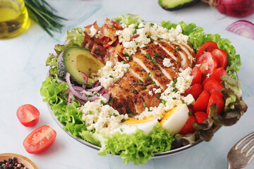 A bowl with cobb salad, traditional American dish	