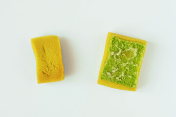 Two used dirty old sponges for washing. White background.