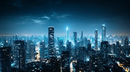 Obraz premium Night cityscape, aerial view, dark blue sky, illuminated skyscrapers, city lights, urban scene, modern architecture, nighttime photography.