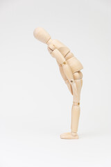 お辞儀をするデッサン人形