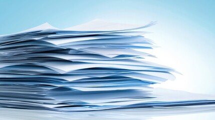 A Mountain of Disorganized Papers Against a Soft Blue Background