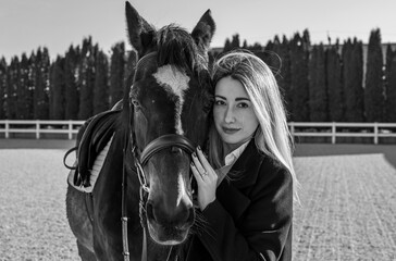 Obraz premium Woman with a horse, countryside place, lady talking to her horse. Portrait of riding horse with woman at rancho