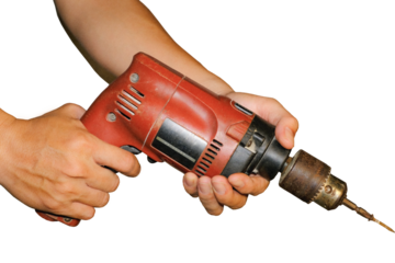 Wood boring drill in hand drilling hole in wooden