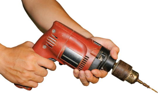 Wood boring drill in hand drilling hole in wooden