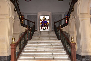 luxurious stairs with wooden banister and handrail
