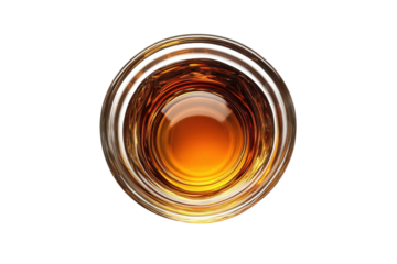 An inviting swirl of amber liquid whispering promises of warmth and rich textures on dark background 100mm lens
