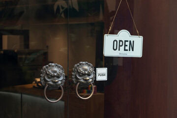open sign hanging outside a restaurant, store, office or other