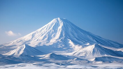 Snowy Volcanic Mountain Peak Under A Clear Blue Sky 
