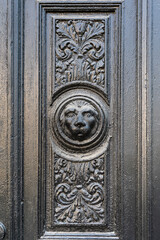 An intricate lion relief decorates a historic door in Lviv, Ukraine, highlighting its beauty