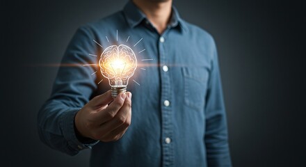 Illuminating Ideas: A man, representing the innovative spirit of the modern professional, holds a glowing light bulb depicting a brain. This imagery sparks a sense of brilliance and innovation. 