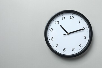 Big beautiful stylish clock on gray background