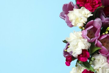Beautiful bouquet of fresh flowers on a color background
