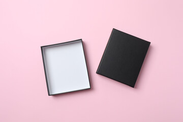 Open cardboard box on pink background