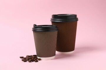 Paper cups with plastic lid on light background. Coffee to go