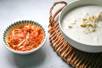 Bean sprouts in coconut milk and a spicy mango relish, a typical food eaten with white rice for lunch or dinner in Malaysia.