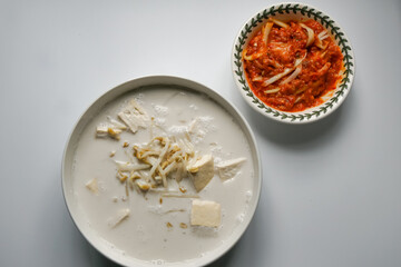 Bean sprouts in coconut milk and a spicy mango relish, a typical food eaten with white rice for lunch or dinner in Malaysia.