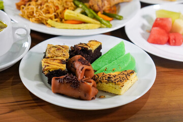 Assorted traditional Indonesian cakes, captured on April 8, 2025. Colorful and sweet treats made with local ingredients, perfect for festive moments and everyday enjoyment