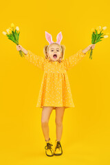 funny child with tulips