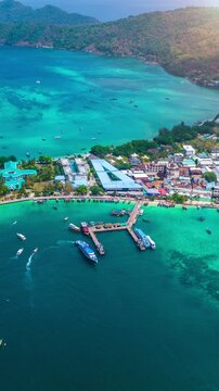 Aerial view of Phi phi island with speedboat sailing on the sea, Thailand.
