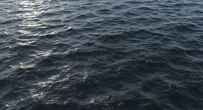 Dynamic ocean surface with rippling water and glittering sunlight reflections