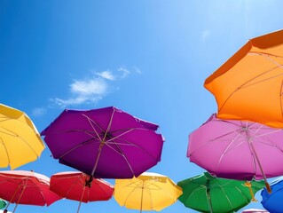 Colorful beach umbrellas with copy space on the bottom