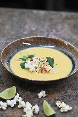 Vibrant Yellow Corn Soup with Popcorn, Chili, and Cilantro – Restaurant Serving