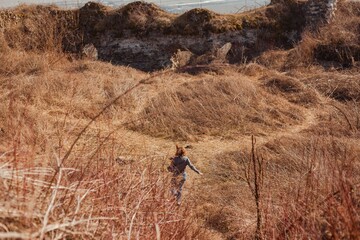 young woman exploring ancient ruins