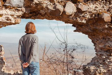 young woman exploring ancient ruins