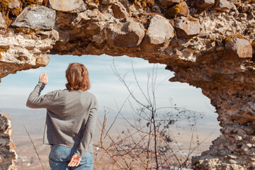 young woman exploring ancient ruins