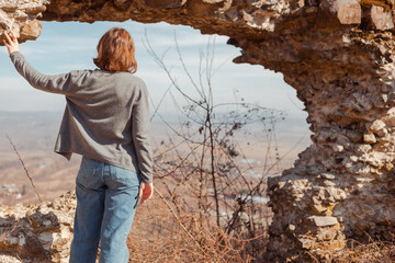 young woman exploring ancient ruins