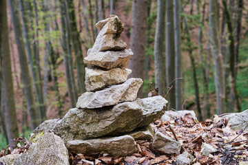 Pyramid-shaped stones stacked along the path in the Trubach Valley in Franconian Switzerland