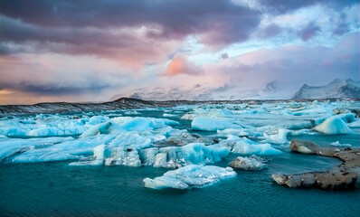 Icebergs drifting to sea in Jokulsarlon during Winter. Jokulsarlon - Iceland