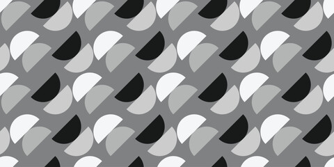 A contemporary modern pattern showcasing striking monochrome shapes in black, white, and multiple shades of gray