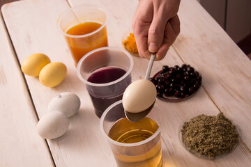 Process of dyeing Easter eggs
