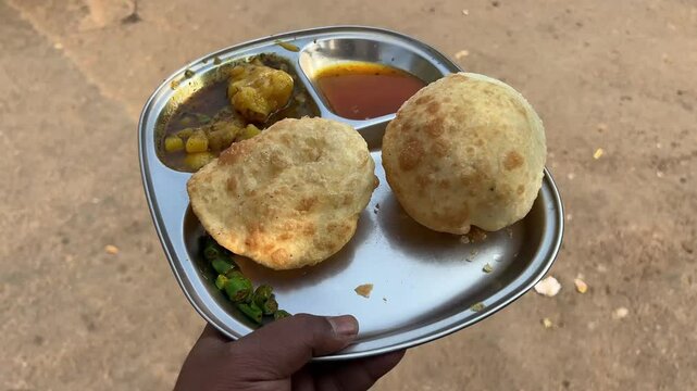 Close up shot of fried club kachori served with alu sabji and chutney
